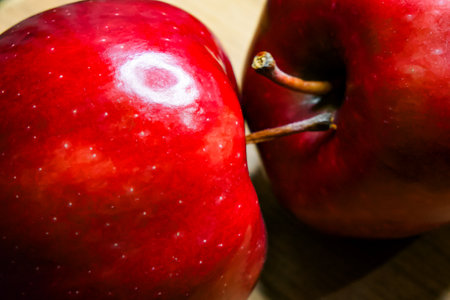 Radiant Red Apples. Apples showcasing bright hue and shiny texture; fresh produce symbol.の写真素材