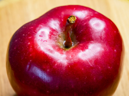 Vibrant Apple Close-Up. A red apple with dew, perfect for food ads.の写真素材
