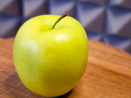 Single apple showcasing natural beauty, apt for food photography and advertisements.の写真素材