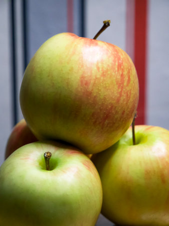 Apples on Display. Apples against stripes, perfect for food-related content.の写真素材