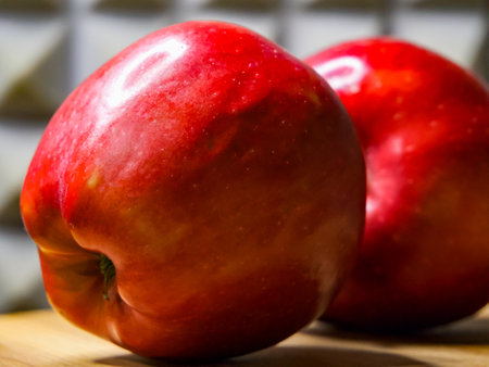 Juicy Apple Pair. A pair of fresh apples on wood, perfect for diet and nutrition ads.