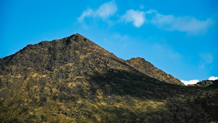 Exploring the scenic Carrauntoohil walkway in Ireland's majestic landscape during a clear day.の写真素材