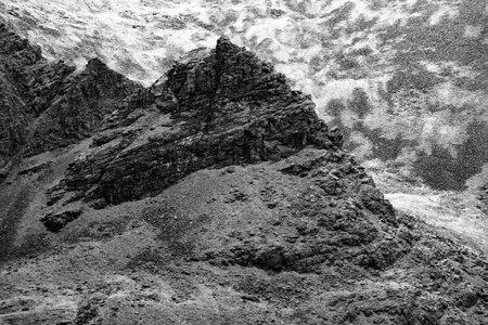 Exploring the rugged terrain of Carrauntoohil walkway in Ireland during a serene hiking adventure.の写真素材