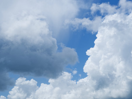 Dreamy, ethereal cloudscape. Soft blue hues and bright white clouds create a tranquil scene. Ideal for design projects.の写真素材