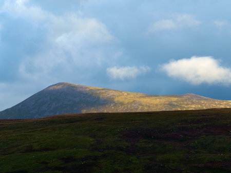 Dramatic mountain scenery near Carrauntoohill showing rugged peaks and rolling hills.