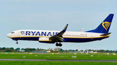 Dublin, Ireland, October 8, 2023. A Ryanair Boeing 737 aircraft with its landing gear down approaches an airport runway from the side.のeditorial素材