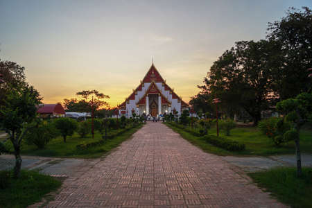 Buddhist temple at a golden sunset in Ayutthaya, Thailandの写真素材