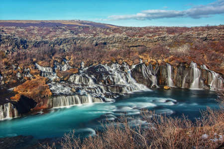 The beautiful Hraunfossar waterfalls captured with long exposure in Icelandの写真素材