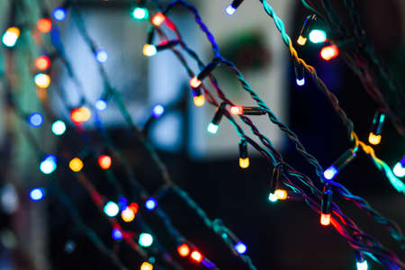 Christmas holiday garland lighted with colorful lightsの写真素材