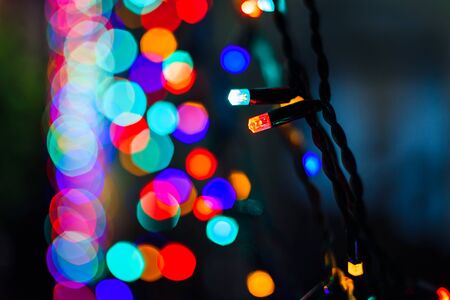 beautiful Christmas garland lights with blurred bokeh in the backgroundの写真素材