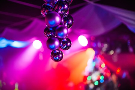beautiful bright background with multicolored Christmas balls on front background with reflectionの写真素材