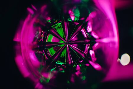 abstract texture green pink purple shot through glass glass with lights for the backgroundの写真素材
