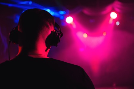 head DJ headphones from back closeup of musical eventの写真素材