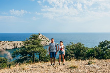 couple in love holds hands with a look forward