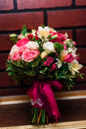 beautiful wedding bouquet with pink roses and white flowers close upの写真素材
