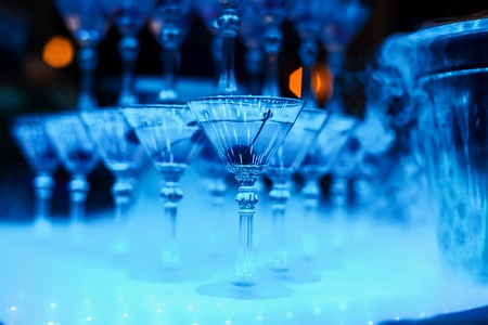 alcoholic cocktail glasses with cherry close-up