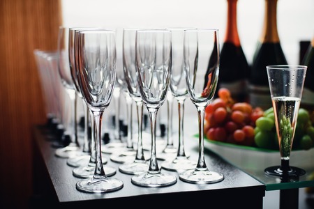 empty champagne glasses for celebration partyの写真素材