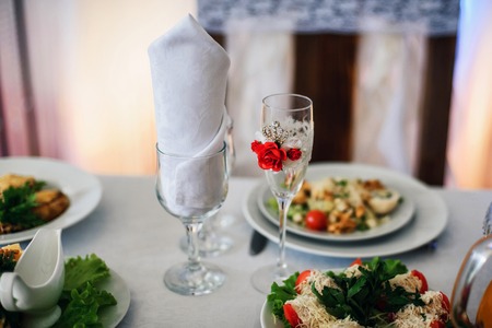 beautifully decorated glasses on the festive tableの写真素材