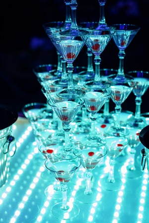 glasses of sweet Martini with cherry on an aperitifの写真素材