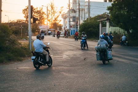 MUI NE, VIETNAM - CIRCA MARCH 2017: A lot of people riding motorbikesのeditorial素材