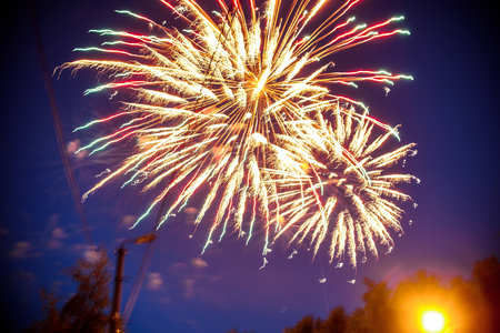 Colorful fireworks on night sky. Explosions of pyrotechnics at festivalの写真素材