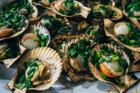 fried mussels with onions for a traditional Asian meal