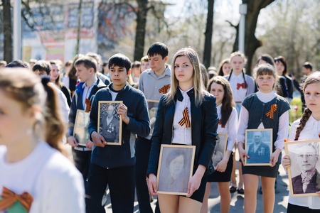 VICHUGA, RUSSIA - MAY 9, 2015: Immortal Regiment - people with portraits of their relatives, participants in the Second World War, on Victory Day paradeのeditorial素材