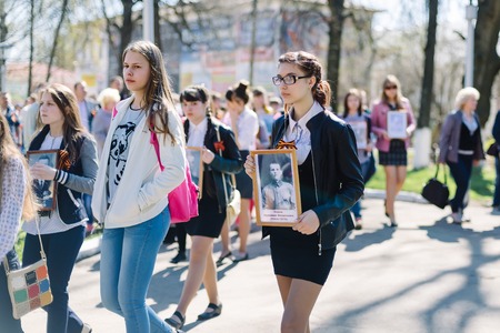 VICHUGA, RUSSIA - MAY 9, 2015: Immortal Regiment - people with portraits of their relatives, participants in the Second World War, on Victory Day paradeのeditorial素材
