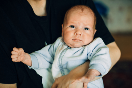 newborn baby boy Caucasian appearance on moms handsの写真素材