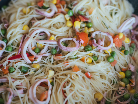 spaghetti with squid and vegetablesの写真素材