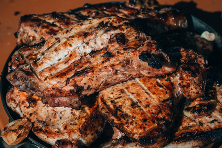 pork meat grilled in a pan close-upの写真素材