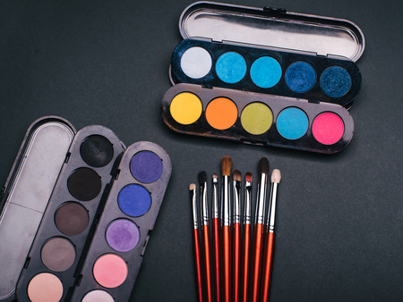 set of makeup brushes and palette with color eye shadowの写真素材