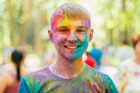 VICHUGA, RUSSIA - JUNE 17, 2018: Festival of colors Holi. Portrait of a happy young manのeditorial素材