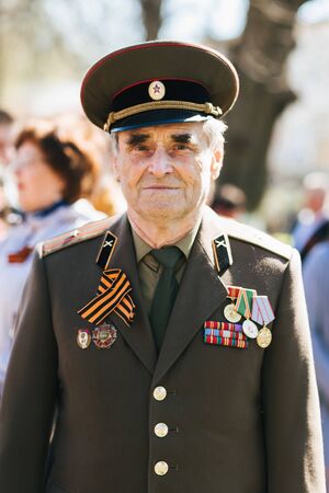 VICHUGA, RUSSIA - MAY 9, 2018: Portrait of a veteran in uniform with orders at victory parade in honor of victory day in world war IIのeditorial素材