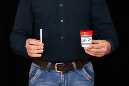 Bank semen and cigarette in the hands of menの写真素材