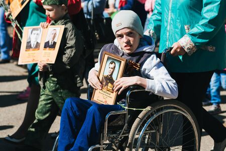 VICHUGA, RUSSIA - MAY 9, 2018: Immortal Regiment - people with portraits of their relatives, participants in the Second World War, on Victory Day paradeのeditorial素材