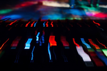 DJ mixer controller Board with color effects from long exposureの写真素材