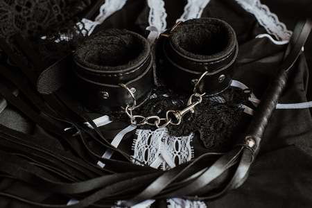 sexual toys for submission and domination in BDSM sex. Whip and handcuffsの写真素材