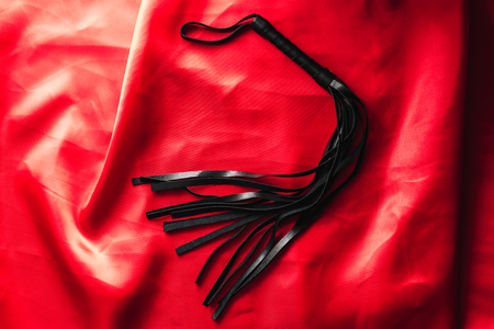 leather black whip for sex games in bdsm sexの写真素材
