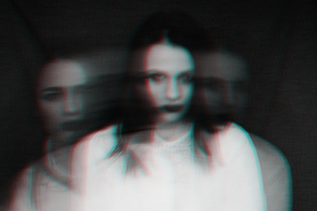 portrait of a girl with mental disorders and split personality with glitch effect