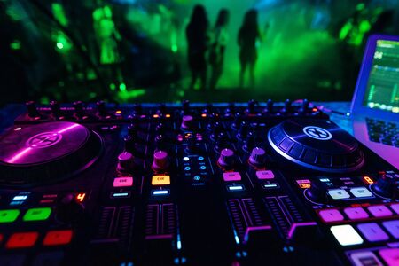 professional DJ mixer controller for mixing music in a nightclubの写真素材