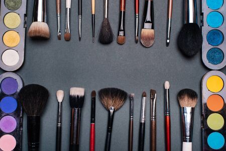 set of brushes and pallets with colored eye shadowsの写真素材