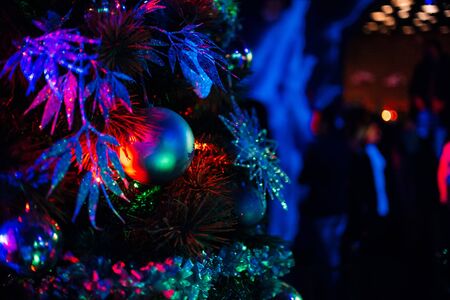 balls and toys on a festive decorated Christmas treeの写真素材
