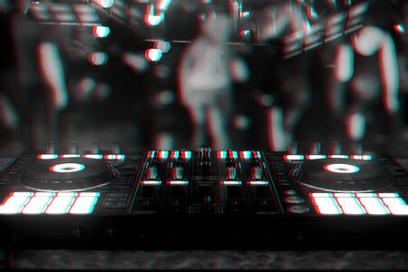 professional DJ controller for mixing electronic music in a nightclub. Black and white photo with glitch effect and small grainの写真素材