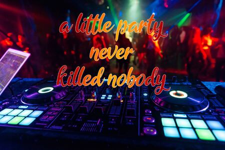 inscription a little party never killed nobody on the background of the DJ mixerの写真素材