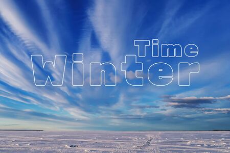 Winter Time concept. The snow on the ice of the lake with the blue sky on a frosty dayの写真素材