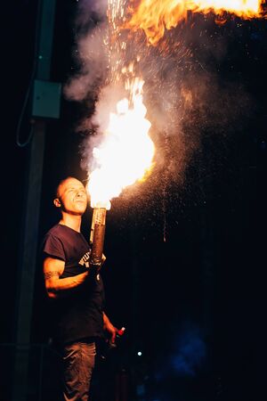 VICHUGA, RUSSIA - JUNE 17, 2018: Fire show, fakir man makes the night presentation