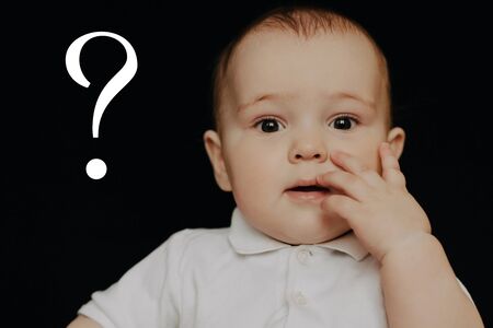 Question mark concept. Surprised questioning little boyの写真素材
