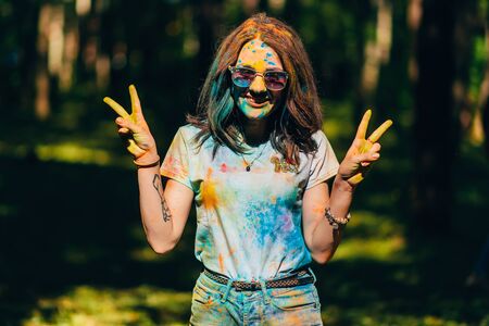 VICHUGA, RUSSIA - JUNE 17, 2018: Festival of colors Holi. Portrait of a young happy girl