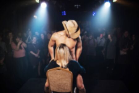 blurred silhouette of a male stripper on the stage of a night clubの写真素材